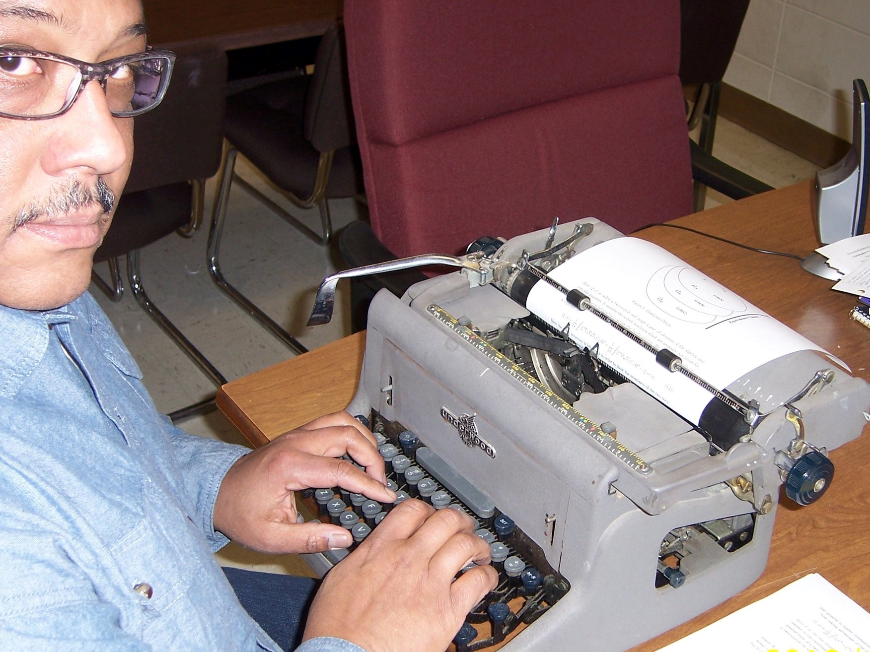 Vincent Rodgers working on a typewriter